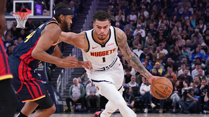 Apr 4, 2025; San Francisco, California, USA; Denver Nuggets forward Michael Porter Jr. (1) drives against Golden State Warriors guard Moses Moody (4) in the second period at Chase Center. Mandatory Credit: David Gonzales-Imagn Images Apr 4, 2025; San Francisco, California, USA; Denver Nuggets forward Michael Porter Jr. (1) drives against Golden State Warriors guard Moses Moody (4) in the second period at Chase Center. Mandatory Credit: David Gonzales-Imagn Images