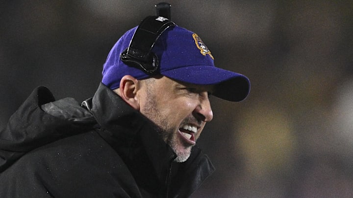 Dec 28, 2024; Annapolis, MD, USA; East Carolina Pirates head coach Blake Harrell reacts during the first half of the Go Bowling Military Bowl against the North Carolina State Wolfpack at Navy-Marine Corps Memorial Stadium. Mandatory Credit: Tommy Gilligan-Imagn Images Dec 28, 2024; Annapolis, MD, USA; East Carolina Pirates head coach Blake Harrell reacts during the first half of the Go Bowling Military Bowl against the North Carolina State Wolfpack at Navy-Marine Corps Memorial Stadium. Mandatory Credit: Tommy Gilligan-Imagn Images