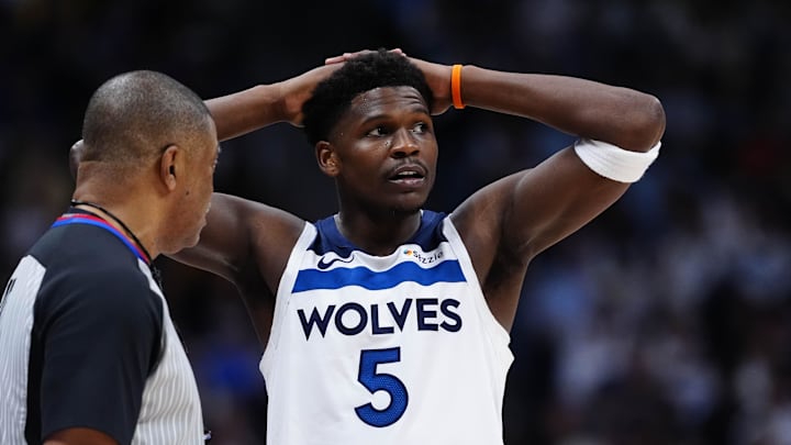 Apr 20, 2026; Denver, Colorado, USA; Minnesota Timberwolves guard Anthony Edwards (5) next to referee Tony Brothers (25) in the second half against the Denver Nuggets during game two of the first round of the 2026 NBA Playoffs at Ball Arena.