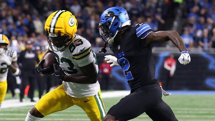 Green Bay Packers wide receiver Savion Williams (83) runs the ball against Detroit Lions cornerback Ennis Rakestraw Jr. (2) Green Bay Packers wide receiver Savion Williams (83) runs the ball against Detroit Lions cornerback Ennis Rakestraw Jr. (2)