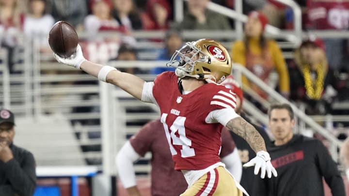 December 30, 2024; Santa Clara, California, USA; San Francisco 49ers wide receiver Ricky Pearsall (14) catches the football against the Detroit Lions during the first quarter at Levi's Stadium. Mandatory Credit: Kyle Terada-Imagn Images