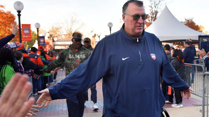 Nov 2, 2024; Champaign, Illinois, USA;  Illinois Fighting Illini head coach Bret Bielema gets a hand from the crowd before the start of a game with the Minnesota Golden Gophers at Memorial Stadium. Mandatory Credit: Ron Johnson-Imagn Images
