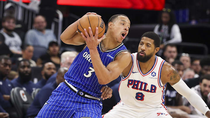 Jan 9, 2026; Orlando, Florida, USA; Orlando Magic guard Desmond Bane (3) controls the ball from Philadelphia 76ers forward Paul George (8) in the second quarter at Kia Center. Mandatory Credit: Nathan Ray Seebeck-Imagn Images