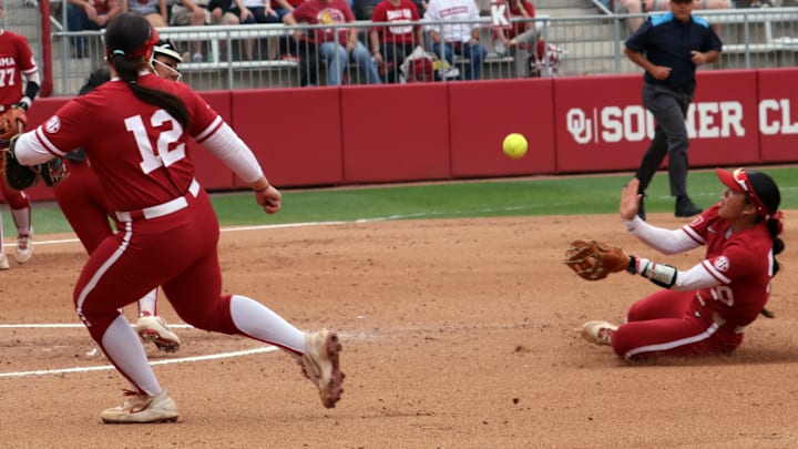 Oklahoma second baseman Ailana Agbayani makes a sliding catch against Kentucky at Love's Field.