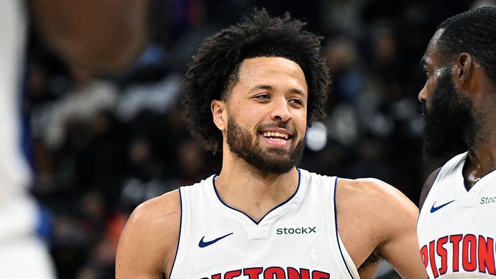 Jan 1, 2025; Detroit, Michigan, USA;  Detroit Pistons guard Cade Cunningham (2) and forward Tim Hardaway Jr. (8) begin to celebrate after Hardaway was fouled late in the fourth quarter against the Orlando Magic to help the Pistons to a victory at Little Caesars Arena. Mandatory Credit: Lon Horwedel-Imagn Images