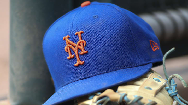 Jul 13, 2022; Atlanta, Georgia, USA; A detailed view of a New York Mets hat and glove in the dugout against the Atlanta Braves in the eighth inning at Truist Park. Jul 13, 2022; Atlanta, Georgia, USA; A detailed view of a New York Mets hat and glove in the dugout against the Atlanta Braves in the eighth inning at Truist Park.