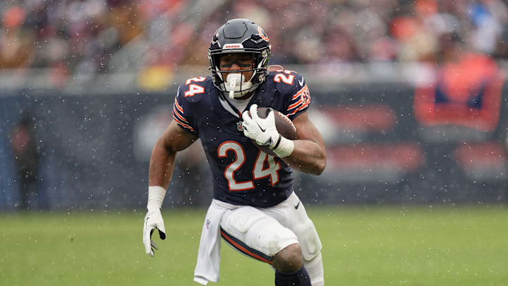 Dec 31, 2023; Chicago, Illinois, USA;  Chicago Bears running back Khalil Herbert (24) runs with the ball against the Atlanta Falcons at Soldier Field. Mandatory Credit: Jamie Sabau-Imagn Images