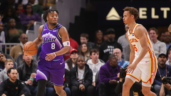 Feb 5, 2026; Atlanta, Georgia, USA; Utah Jazz guard Isaiah Collier (8) is defended by Atlanta Hawks guard Dyson Daniels (5) in the first quarter at State Farm Arena. Mandatory Credit: Brett Davis-Imagn Images