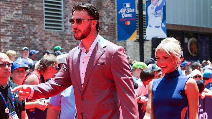 Jul 15, 2025; Atlanta, GA, USA; National League pitcher Paul Skenes (30) of the Pittsburgh Pirates and social media influencer Livvy Dunne walk on the red carpet before the 2025 MLB All Star Game at Truist Park. Mandatory Credit: Brett Davis-Imagn Images