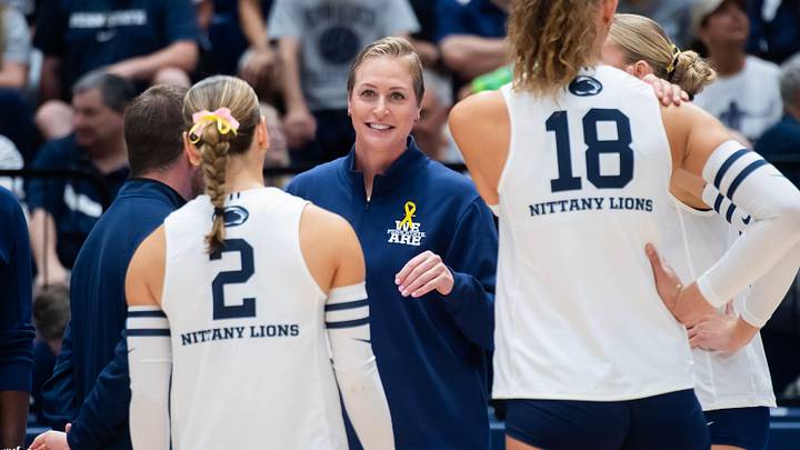Penn State head coach Katie Schumacher-Cawley talks to her players during a timeout in a Big Ten volleyball match against UCLA on Sunday, Sept. 28, 2025, in State College.