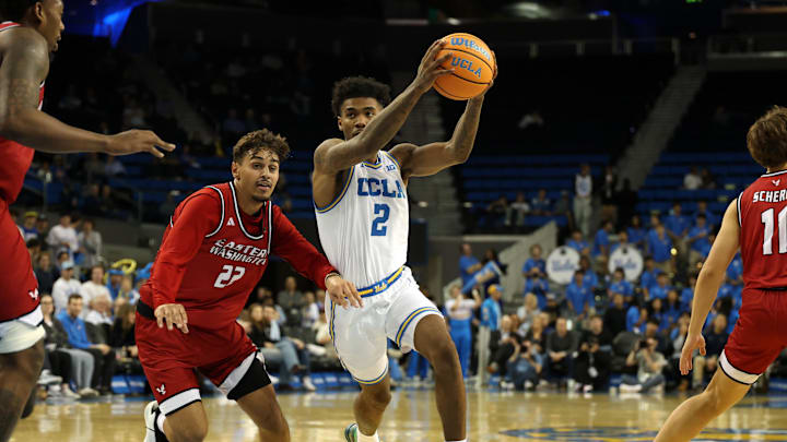 Nov 3, 2025; Los Angeles, California, USA;  UCLA Bruins guard Donovan Dent (2) drives to the basket against Eastern Washington Eagles guard Jojo Anderson (22) during the second half at Pauley Pavilion presented by Wescom Financial. Mandatory Credit: Kiyoshi Mio-Imagn Images