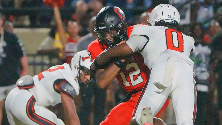 Thompson's Trenton McCorvey (0) sacks Central-Phenix City's Bobby Coleman (12) during the AHSAA Football Kickoff Classic Game in Phenix City, Ala., on Thursday August 20, 2026.