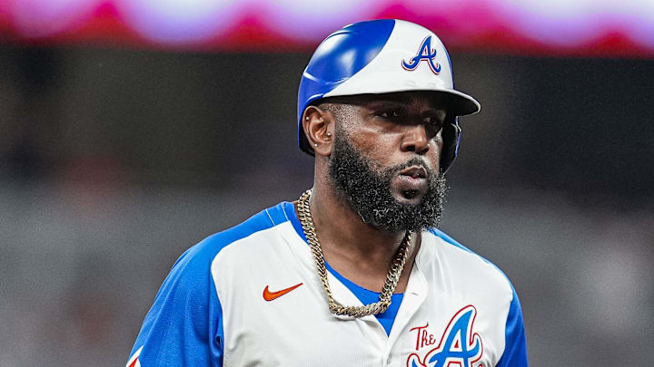 Aug 9, 2025; Cumberland, Georgia, USA; Atlanta Braves designated hitter Marcell Ozuna (20) reacts after hitting a home run against the Miami Marlins during the fifth inning at Truist Park. Mandatory Credit: Dale Zanine-Imagn Images