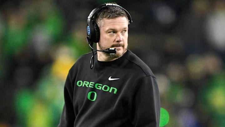 Dec 20, 2025; Eugene, OR, USA;  Oregon Ducks head coach Dan Lanning looks on during the fourth quarter against the James Madison Dukes at Autzen Stadium. Mandatory Credit: Craig Strobeck-Imagn Images