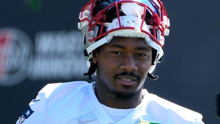 New England Patriots wide receiver Stefon Diggs talks to the media as he enters the practice field on July 23, 2025, for the opening day of Patriots training camp at Gillette Stadium in Foxboro, Massachusetts.