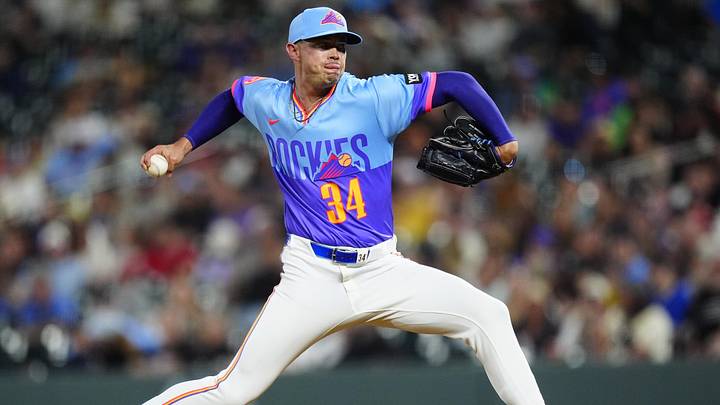 May 29, 2026; Denver, Colorado, USA; Colorado Rockies relief pitcher Keegan Thompson (34) delivers a pitch in the eighth inning against the San Francisco Giants at Coors Field. Mandatory Credit: Ron Chenoy-Imagn Images