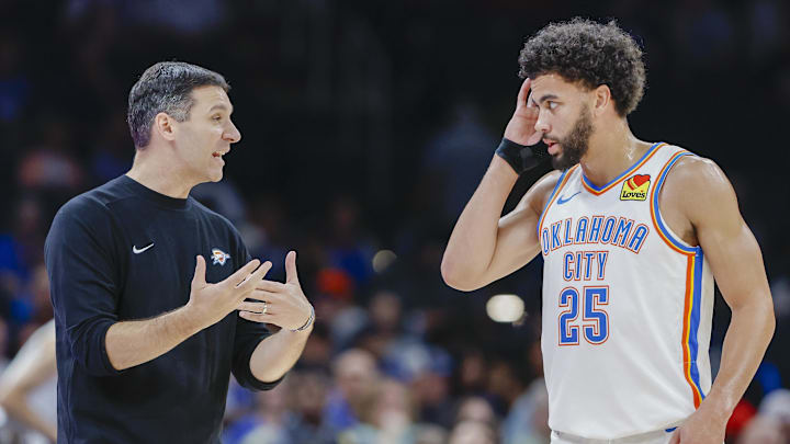 Oct 9, 2024; Oklahoma City, Oklahoma, USA; Oklahoma City Thunder head coach Mark Daigneault talks to guard Ajay Mitchell (25) during a break in play in the second half at Paycom Center. Mandatory Credit: Alonzo Adams-Imagn Images