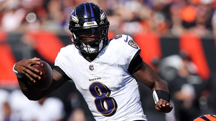 Oct 6, 2024; Cincinnati, Ohio, USA; Baltimore Ravens quarterback Lamar Jackson (8) escapes the tackle of Cincinnati Bengals safety Geno Stone (22) during the second half at Paycor Stadium. Mandatory Credit: Joseph Maiorana-Imagn Images Oct 6, 2024; Cincinnati, Ohio, USA; Baltimore Ravens quarterback Lamar Jackson (8) escapes the tackle of Cincinnati Bengals safety Geno Stone (22) during the second half at Paycor Stadium. Mandatory Credit: Joseph Maiorana-Imagn Images