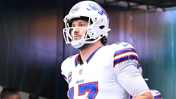 Buffalo Bills QB Josh Allen runs on to the field before an AFC Wild Card Round game against the Jacksonville Jaguars. Buffalo Bills QB Josh Allen runs on to the field before an AFC Wild Card Round game against the Jacksonville Jaguars.