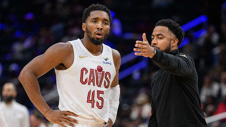 Oct 26, 2024; Washington, District of Columbia, USA; Cleveland Cavaliers guard Donovan Mitchell (45) speaks to Cleveland Cavaliers associate head coach Johnnie
Bryant during a time out in the third quarter against the Washington Wizards at Capital One Arena. Mandatory Credit: Reggie Hildred-Imagn Images