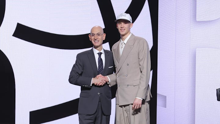 Jun 25, 2025; Brooklyn, NY, USA;  Egor Demin stands with NBA commissioner Adam Silver after being selected as the eighth pick by the Brooklyn Nets in the first round of the 2025 NBA Draft at Barclays Center. Mandatory Credit: Brad Penner-Imagn Images