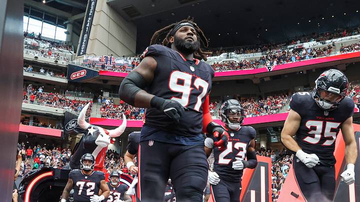 Dec 15, 2024; Houston, Texas, USA; Houston Texans defensive tackle Mario Edwards Jr. (97) and linebacker Jake Hansen (35) run onto the field before the game against the Miami Dolphins at NRG Stadium. Mandatory Credit: Troy Taormina-Imagn Images Dec 15, 2024; Houston, Texas, USA; Houston Texans defensive tackle Mario Edwards Jr. (97) and linebacker Jake Hansen (35) run onto the field before the game against the Miami Dolphins at NRG Stadium. Mandatory Credit: Troy Taormina-Imagn Images