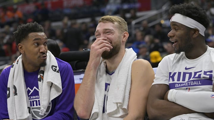 Dec 3, 2022; Los Angeles, California, USA;  Sacramento Kings guard Malik Monk (0) and forward Domantas Sabonis (10) and guard Terence Davis (3) react on the bench in the fourth quarter against the Los Angeles Clippers at Crypto.com Arena. Mandatory Credit: Jayne Kamin-Oncea-Imagn Images