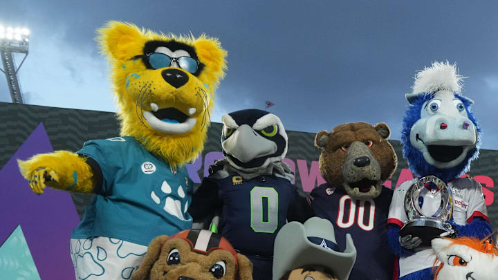 Feb 2, 2025; Orlando, FL, USA; Mascots Jaxson de Ville of the Jacksonville Jaguars, Champs of the Cleveland Browns, Blitz of the Seattle Seahawks, Rowdy of the Dallas Cowboys, Staley of the Chicago Bears, Blue of the Indianapolis Colts, Miles of the Denver Broncos, Viktor of the Minnesota Vikings and Steely McBeam of the Pittsburgh Steelers pose during the 2025 Pro Bowl Games at Camping World Stadium. Mandatory Credit: Kirby Lee-Imagn Images