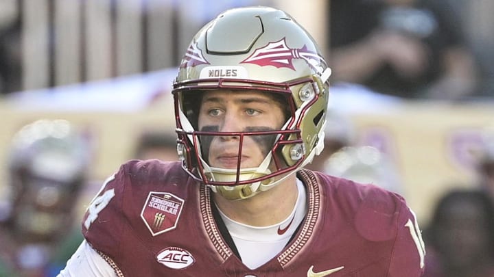 Nov 23, 2024; Tallahassee, Florida, USA; Florida State Seminoles quarterback Luke Kromenhoek (14) looks to throw during the second half of the game against the Charleston Southern Buccaneers at Doak S. Campbell Stadium. Mandatory Credit: Melina Myers-Imagn Images