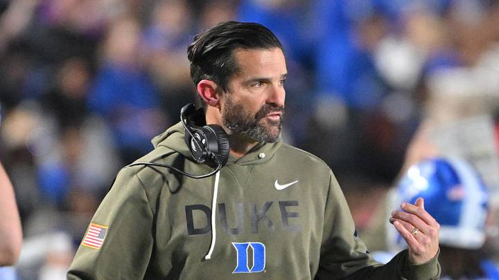 Nov 15, 2025; Durham, North Carolina, USA; Duke Blue Devils head coach Manny Diaz reacts during the third quarter against the Virginia Cavaliers at Wallace Wade Stadium. Mandatory Credit: Zachary Taft-Imagn Images Nov 15, 2025; Durham, North Carolina, USA; Duke Blue Devils head coach Manny Diaz reacts during the third quarter against the Virginia Cavaliers at Wallace Wade Stadium. Mandatory Credit: Zachary Taft-Imagn Images