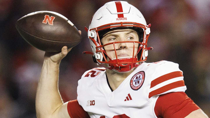 Nebraska Cornhuskers quarterback throws a pass