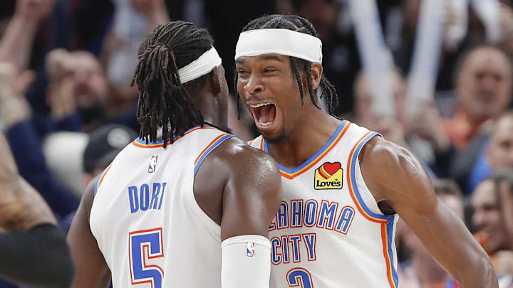 Dec 21, 2022; Oklahoma City, Oklahoma, USA; Oklahoma City Thunder guard Shai Gilgeous-Alexander (2) and Oklahoma City Thunder guard Luguentz Dort (5) celebrate at the end of their game against the Portland Trial Blazers at Paycom Center. Oklahoma City won 101-98. Mandatory Credit: Alonzo Adams-Imagn Images
