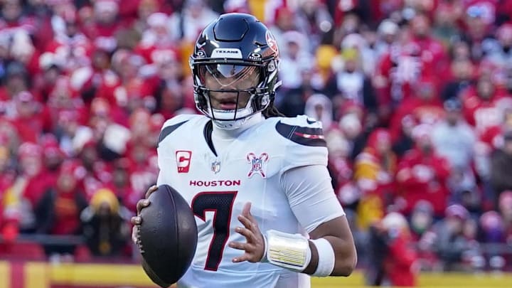 Dec 21, 2024; Kansas City, Missouri, USA; Houston Texans quarterback C.J. Stroud (7) looks to  pass against the Kansas City Chiefs during the second half at GEHA Field at Arrowhead Stadium. Mandatory Credit: Denny Medley-Imagn Images