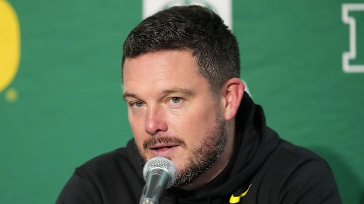 Nov 16, 2024; Madison, Wisconsin, USA;  Oregon Ducks head coach Dan Lanning talks to the media during the post game press conference following the game against the Wisconsin Badgers at Camp Randall Stadium. Mandatory Credit: Jeff Hanisch-Imagn Images