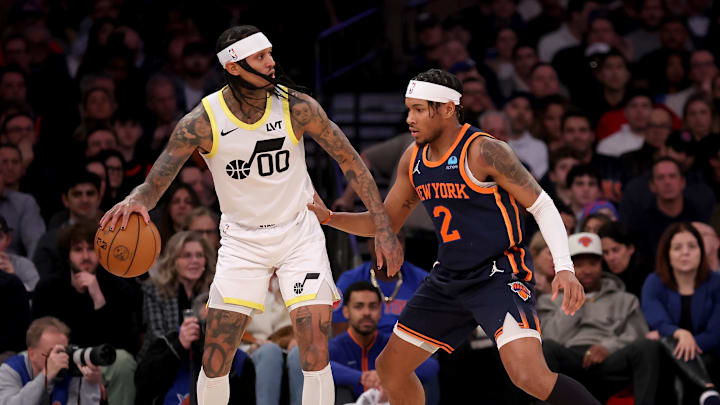 Jan 30, 2024; New York, New York, USA; Utah Jazz guard Jordan Clarkson (00) controls the ball against New York Knicks guard Miles McBride (2) during the first quarter at Madison Square Garden. Mandatory Credit: Brad Penner-Imagn Images