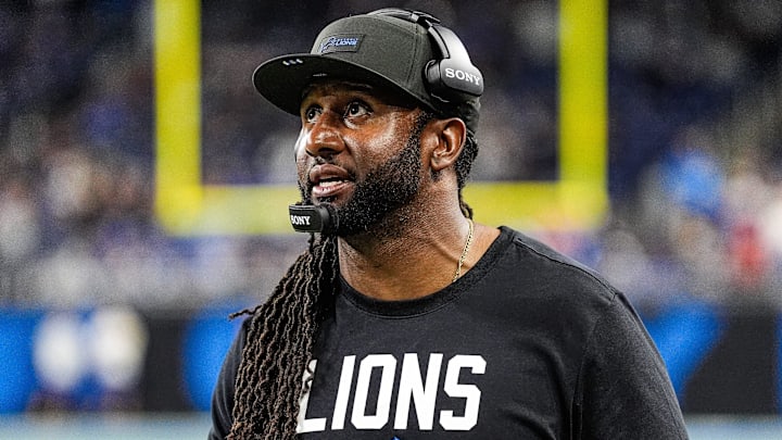 Detroit Lions defensive coordinator Kelvin Sheppard watches a replay against Tampa Bay Buccaneers during the second half at Ford Field in Detroit on Monday, Oct. 20, 2025.
