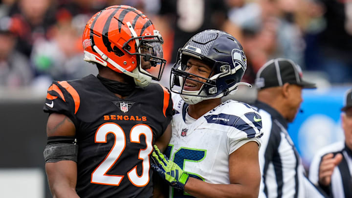 Cincinnati Bengals safety Dax Hill (23) is taken aside by Seattle Seahawks wide receiver Tyler Lockett (16) after laying a hit on wide receiver Jake Bobo (19) in the third quarter of the NFL Week 6 game between the Cincinnati Bengals and the Seattle Seahawks at Paycor Stadium in downtown Cincinnati on Sunday, Oct. 15, 2023. The Bengals improved to 3-3 on the season with a 17-13 at home.