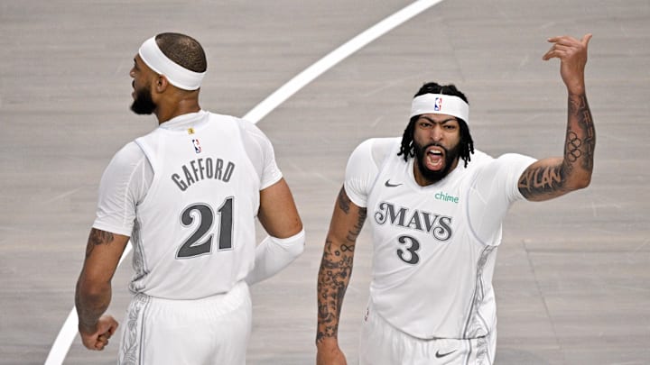 Feb 8, 2025; Dallas, Texas, USA; Dallas Mavericks center Daniel Gafford (21) and forward Anthony Davis (3) celebrate after Davis dunks the ball against the Houston Rockets during the first quarter at American Airlines Center. Mandatory Credit: Jerome Miron-Imagn Images