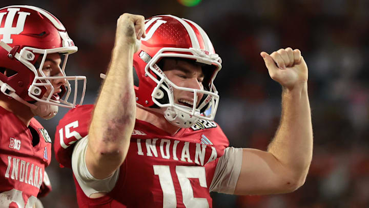 Jan 19, 2026; Miami Gardens, FL, USA; Indiana Hoosiers quarterback Fernando Mendoza (15) celebrates after scoring a touchdown against the Miami Hurricanes in the fourth quarter during the College Football Playoff National Championship game at Hard Rock Stadium. Mandatory Credit: Sam Navarro-Imagn Images