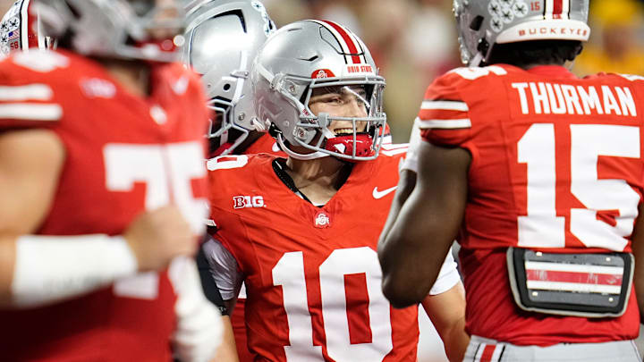 Ohio State Buckeyes quarterback Julian Sayin (10) smiles after a touchdown pass to Carnell Tate during the NCAA football game against the Minnesota Golden Gophers at Ohio Stadium in Columbus on Oct. 4, 2025.