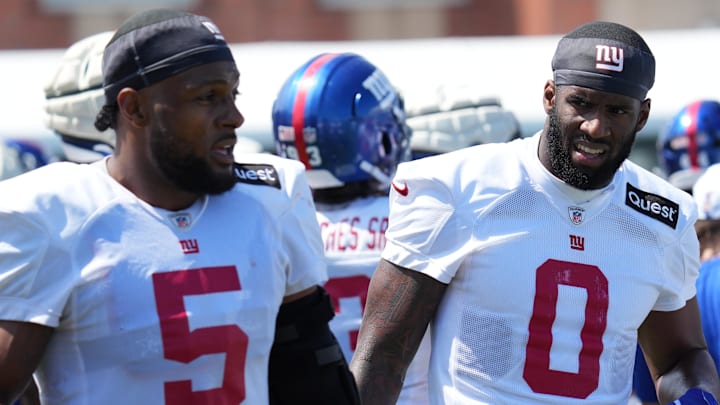 Jul 26, 2024; East Rutherford, NJ, USA; New York Giants linebacker Kayvon Thibodeaux (5) and New York Giants linebacker Brian Burns (0) break on the sideline during training camp at Quest Diagnostics Training Center. Mandatory Credit: Lucas Boland-Imagn Images Jul 26, 2024; East Rutherford, NJ, USA; New York Giants linebacker Kayvon Thibodeaux (5) and New York Giants linebacker Brian Burns (0) break on the sideline during training camp at Quest Diagnostics Training Center. Mandatory Credit: Lucas Boland-Imagn Images
