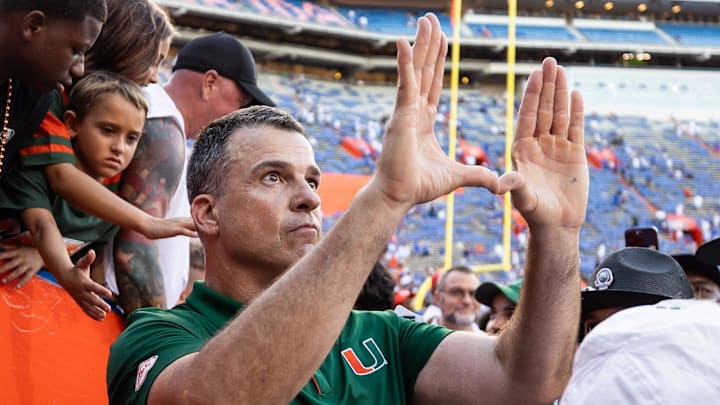Aug 31, 2024; Gainesville, Florida, USA; Miami Hurricanes head coach Mario Cristobal gestures after a game against the Florida Gators at Ben Hill Griffin Stadium. Mandatory Credit: Matt Pendleton-Imagn Images