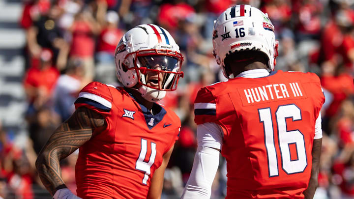 Oct 19, 2024; Tucson, Arizona, USA; Arizona Wildcats wide receiver Tetairoa McMillan (4) and wide receiver Chris Hunter (16) against the Colorado Buffalos at Arizona Stadium