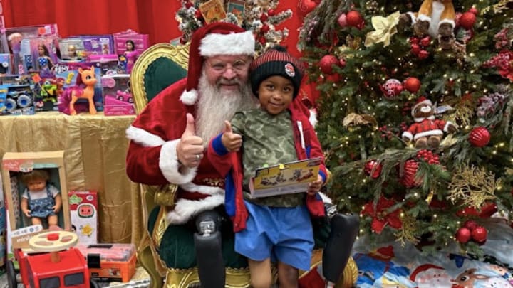 Matt Aldridge Former Shriners Children's Patient and Paralympian Spreads Christmas Magic at Shriner's Children's Greenville