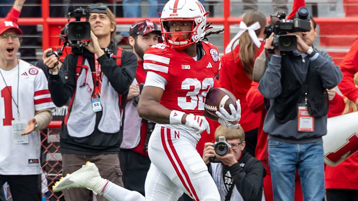 Nebraska's Kenneth Williams checks for Northwestern pursuers during his 95-yard kickoff return. Nebraska's Kenneth Williams checks for Northwestern pursuers during his 95-yard kickoff return.