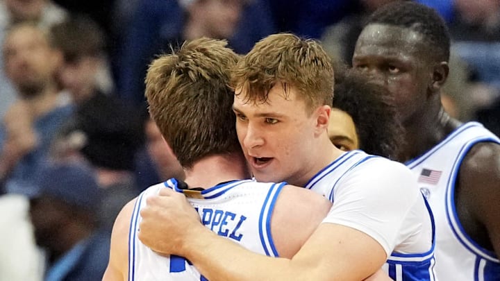 Mar 29, 2025; Newark, NJ, USA; Duke Blue Devils forward Cooper Flagg (2) celebrates with guard Kon Knueppel (7) after a play during the first half against the Alabama Crimson Tide in the East Regional final of the 2025 NCAA tournament at Prudential Center. Mandatory Credit: Robert Deutsch-Imagn Images