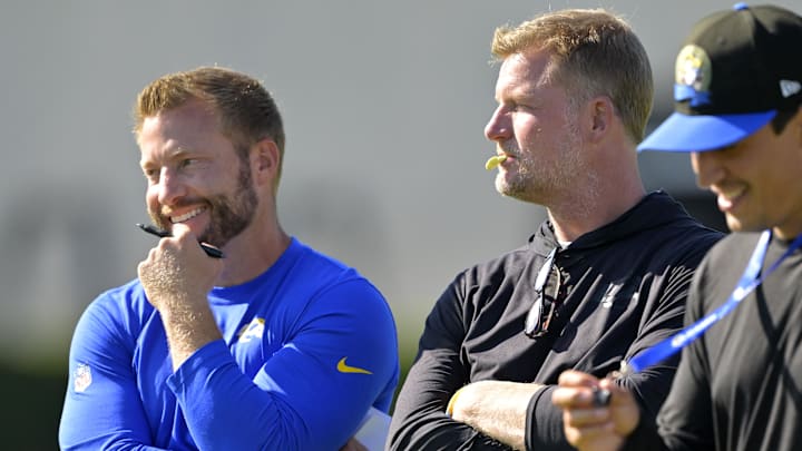 Jul 29, 2024; Los Angeles, CA, USA; Los Angeles Rams head coach Sean McVay, general manager Les Snead and chief of staff Carter Crutchfield talk on the field during training camp at Loyola Marymount University. Mandatory Credit: Jayne Kamin-Oncea-Imagn Images