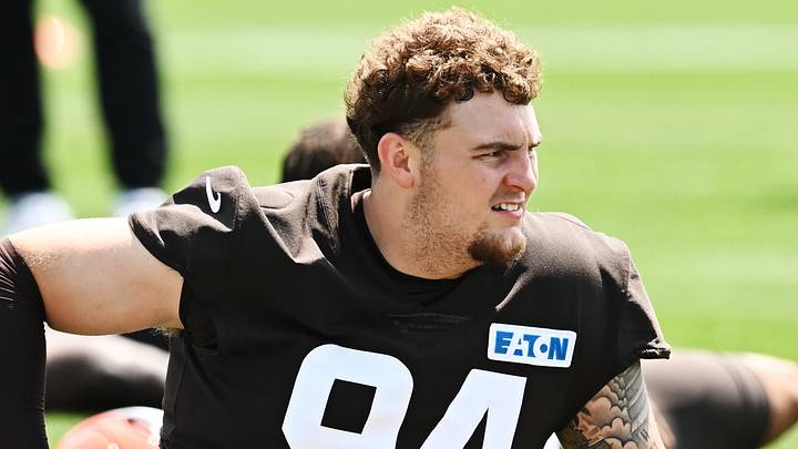 Cleveland Browns defensive tackle Mason Graham stretching