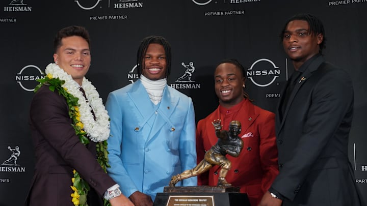 Dec 14, 2024; New York, NY, USA; From left, Heisman Trophy nominees Oregon Ducks quarterback Dillon Gabriel, Colorado Buffaloes wide receiver/cornerback Travis Hunter, Boise State Broncos running back Ashton Jeanty and Miami Hurricanes quarterback Cam Ward pose for a photo during a press conference before the 2024 Heisman Trophy Presentation.