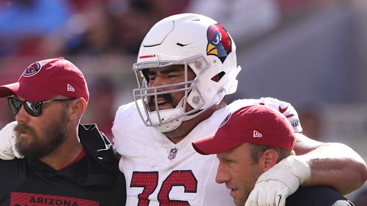 Oct 6, 2024; Santa Clara, California, USA; Arizona Cardinals guard Will Hernandez (76) is helped off of the field by medical personnel after suffering an injury during the fourth quarter against the San Francisco 49ers at Levi's Stadium. Mandatory Credit: Darren Yamashita-Imagn Images